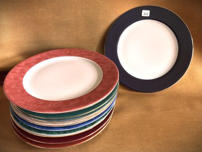 many plates stacked on top of each other on a table