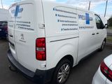 a white van that is parked in a parking lot