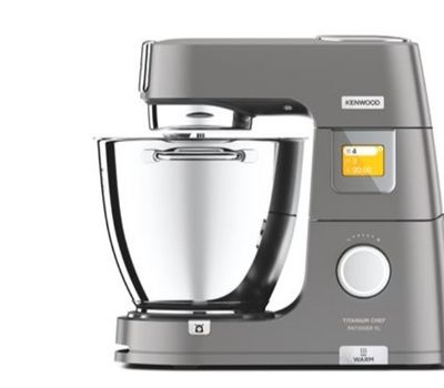 a close up of a silver mixer on a white background