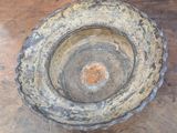 a dirty bowl sitting on a wooden table