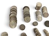 a lot of coins that are on a white surface