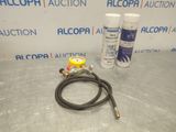 a couple of hoses sitting on top of a table next to a can of alcohol