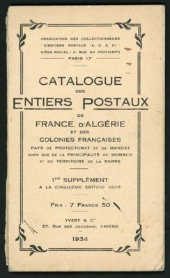 an old book with a picture of a cat sitting on top of it