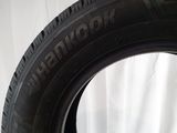 a close up of a tire on a white surface with a white background