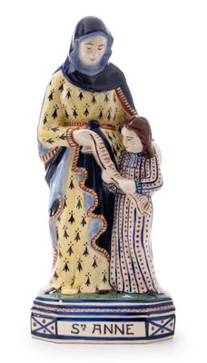 a figurine of a woman holding a child in her arms