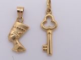 an image of a couple of gold keys sitting next to each other
