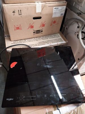 a laptop computer sitting on top of a pile of boxes