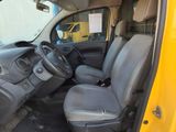 a yellow truck with a black seat and steering wheel