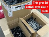 two boxes of screws and a box of wires on a table