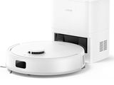 une image représentant un aspirateur robot blanc et une boîte blanche