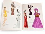 an open book with a drawing of women ' s fashions on it