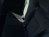 the back seats of a car are empty in a parking lot