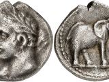 an image of a silver coin with an image of a man and an elephant on it