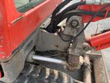 a close up view of the front end of a red truck