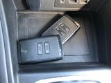 a remote control in the center console of a car