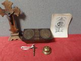 an old wooden box with a cross, a book, and a key