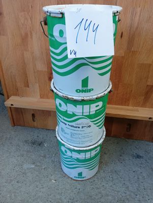 a stack of three buckets with a sign on them