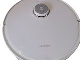 an image of a robotic vacuum cleaner on a white surface