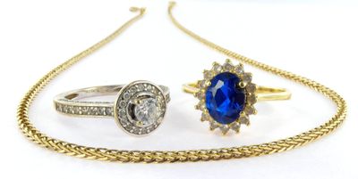 two rings, a necklace and a ring with a sapphire stone