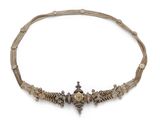 a gold and silver necklace with a cross on it
