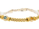 a close up of a bracelet on a white background
