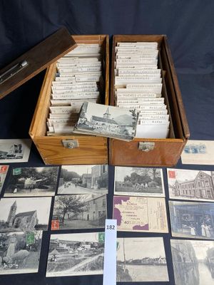 a box full of old postcards on a table