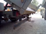 a dump truck that is parked on the side of the road