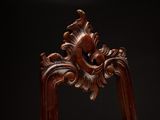 a wooden frame with a carved design on it