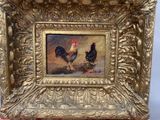 une photo d'un tableau représentant deux poulets, dans un cadre doré