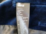 a label on the back of a jacket that has a price tag on it