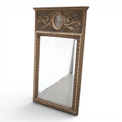 a mirror that is sitting on a white surface