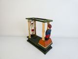 toy figurine of a man and woman on a platform