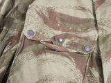 a close up of a military jacket with buttons on it