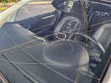 a car that has been vandalized with graffiti on the windshield