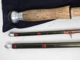 three different types of fishing rods on a table
