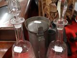 a red table with a bunch of glass items on it