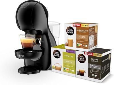 a black coffee machine with a cup of coffee next to it