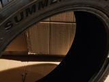 a close up of a tire on a cardboard box on a floor