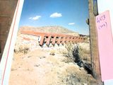 an open book with a picture of a cactus in the desert