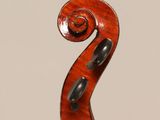 an old violin with a long neck and a curved back