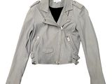 the leather jacket is grey and has a zippered collar