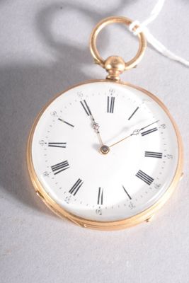 a gold pocket watch with roman numerals on the face