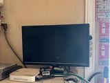 a television sitting on top of a cabinet in a room