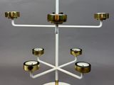 an image of a white and gold candelier with candles on it