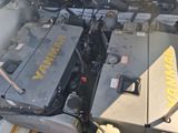 an image of a car engine with the hood open