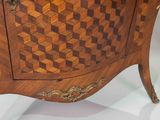 a wooden cabinet with a checkered design on it