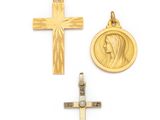 two gold crosses and a medal on a white background