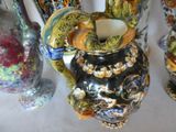 a lot of vases that are sitting on a table