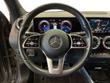 the interior of a car with a steering wheel and dashboard controls