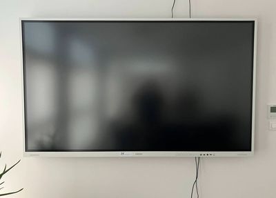 a flat screen tv mounted on the wall in a living room